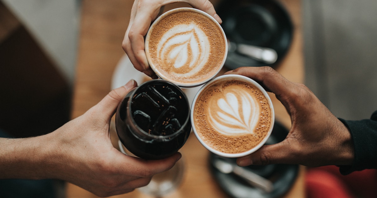 A person enjoying a peaceful morning with coffee and sunlight